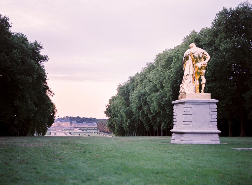 Golden statue in the gardens of the Chateau Vaux le Vicomte