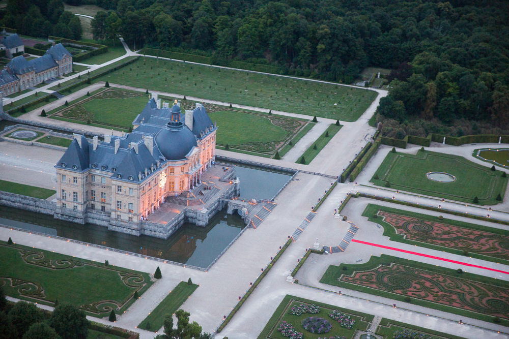 Aerial view of the Chateau Vaux le Vicomte and its gardens during a wedding reception