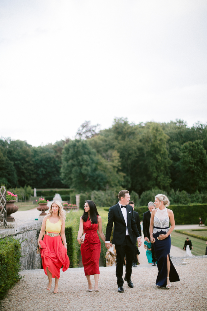 Stylish guests at a luxury wedding in a private French chateau